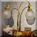 DL14. Brass two-light lamp with glass globe shades. 